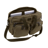 Green bag with multiple compartments and a shoulder strap on a white background