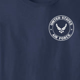 Close-up of a navy blue t-shirt featuring a white circular United States Air Force emblem printed on the left chest.