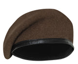 Brown beret with black band on a white background