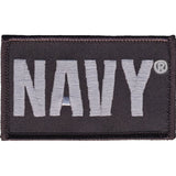 An embroidered rectangular patch with the word 'NAVY' in large light gray letters on a dark charcoal background, shown on a plain white background.