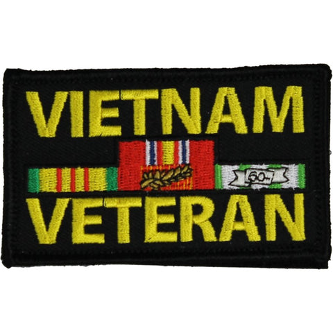A rectangular embroidered patch with a black background and the words 'VIETNAM VETERAN' in large yellow letters. In the center, there are military service ribbon graphics in red, green, yellow, white, and blue.