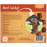 Back of a dog treat pouch package showing product information, ingredients, feeding guidelines, a photo of a happy dog, and a barcode on an orange and tan background.
