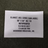 Label on a blanket with text about the product details.
