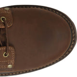 Close-up of a brown leather shoe with stitching details on a white background