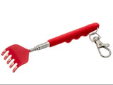 A red pet grooming rake with a textured red handle and a silver metal clasp, shown on a plain white background.
