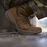 Tan military boot on a blurred background