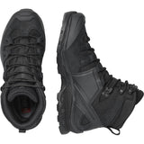 Pair of black tactical boots on a white background