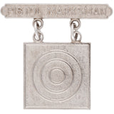 Silver 'Pistol Marksman' badge with target design on a white background