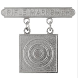 Silver 'Rifle Marksman' badge with target design on a white background