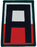 Patch with a large letter 'P' in black, white, and red on a green border.