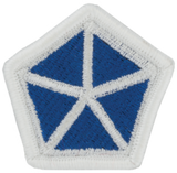  Pentagon-shaped patch with blue center and white border on a white background
