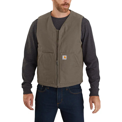 A male model wearing a brown Carhartt vest with a full zip front, droptail hem, and two front pockets.
