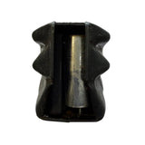A black ammo magazine, photographed from above on a white sheet of paper against a dark gray surface.