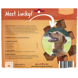 Back of a Shop Lucky and Friends pet treat pouch labeled 'Meet Lucky!' with product details, ingredients, feeding guidelines, a barcode, and a photo of a dog on a warm orange-brown package.