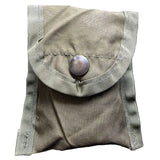 A small olive drab canvas pouch with a flap closure secured by a round metal snap button, shown against a plain white background.