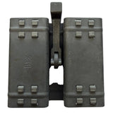 A pair of vintage double magazine binoculars in dark gray metal, featuring a central hinge with a vertical handle and multiple screw terminals on the front.