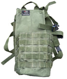 An olive green tactical backpack pouch with MOLLE webbing and plastic buckle closures, laid flat on gray asphalt pavement.
