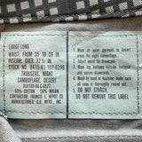 Close-up of a garment's interior label showing size and care instructions. The label reads 'LARGE-LONG' and lists measurements, fabric composition as 50% cotton and 50% nylon, and washing instructions.