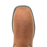 Close-up top view of a brown leather boot toe showing the textured leather vamp, decorative stitching, and edge of a black sole on a white background.