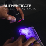 Person using a UV light to authenticate money with text 'Authenticate Illuminate security strips & UV ink'.