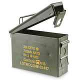 A green metal ammo can with a rubber seal in the lid, marked with military specifications for 30 Cal ammunition.
